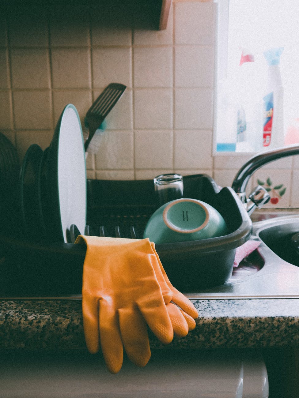 yellow latex gloves on dish rack