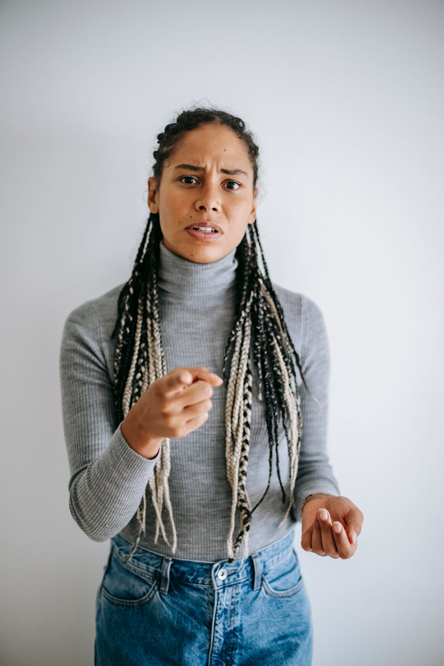 ethnic woman frowning face and pointing at camera