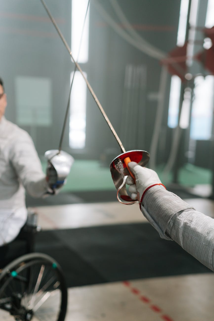 close up of two men fencing