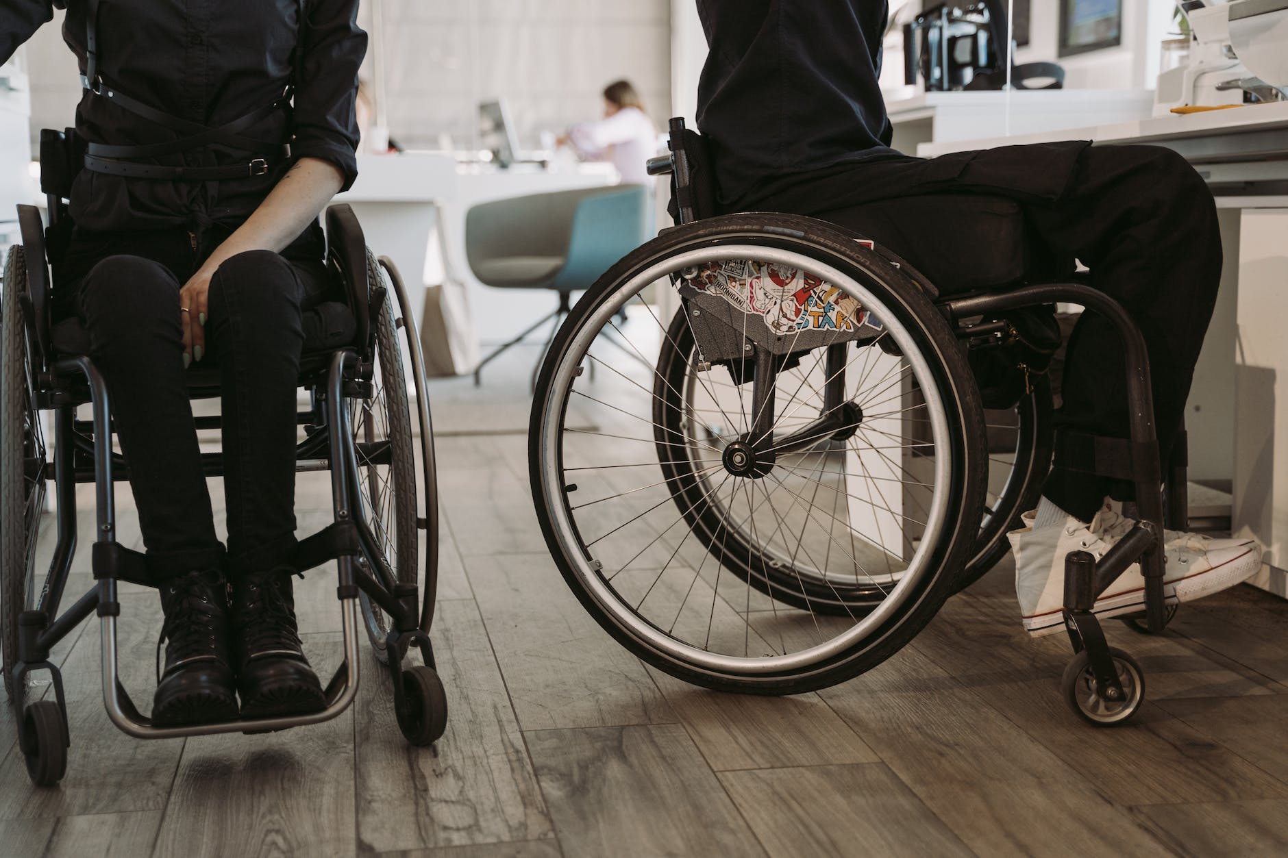 person in black pants and black shirt sitting on wheelchair