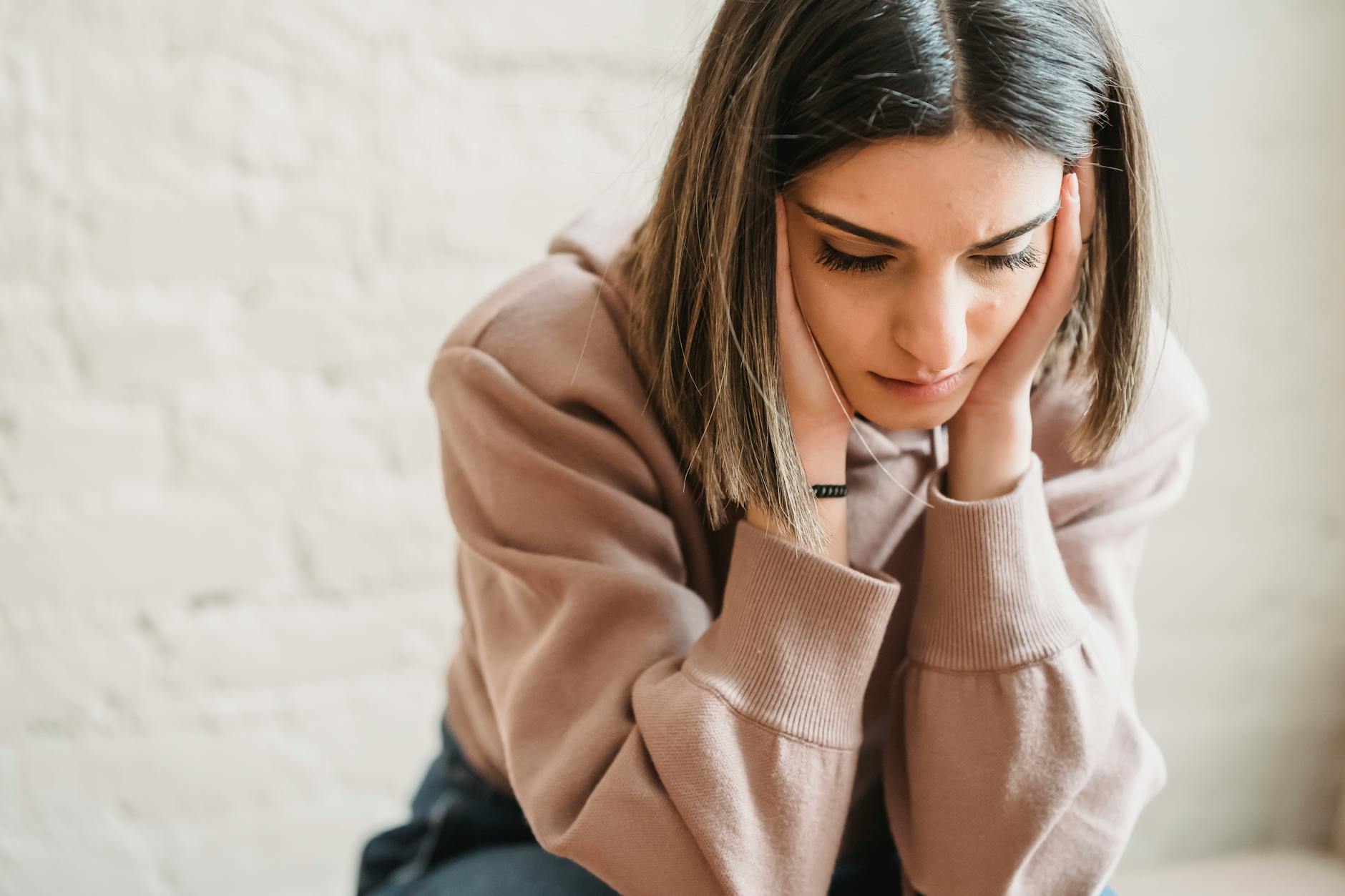 sad woman sitting in room